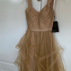 Gold colored Jovanni dress size 0-extra small new with tags. Never worn.